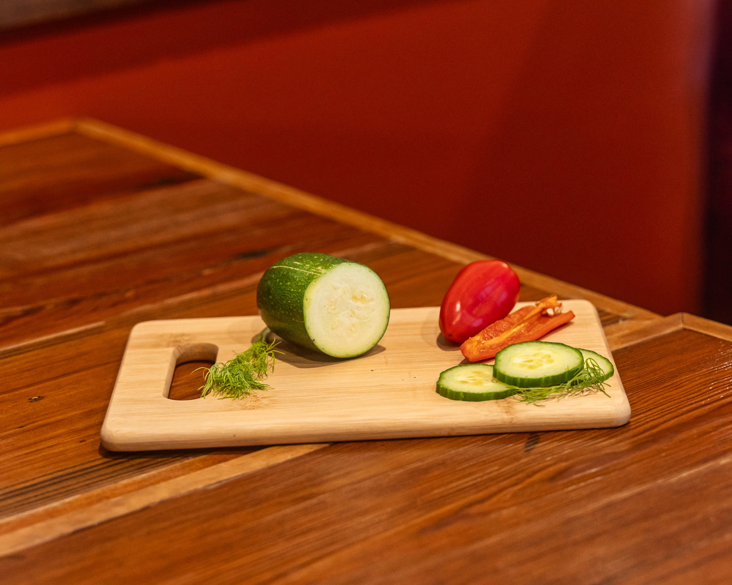 Beautifully crafted 9" x 6" rectangle shaped bamboo cutting board with handle